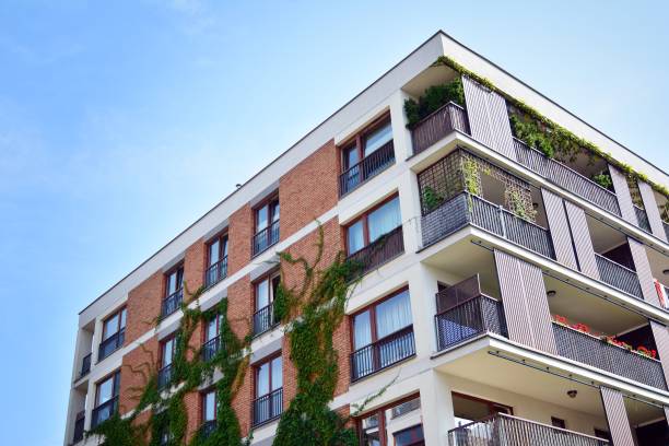 istock Modern apartment buildings on a sunny day with a blue sky. 1182186398