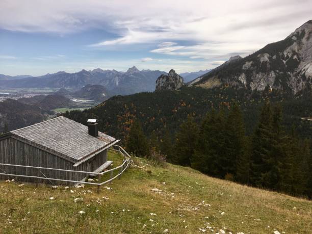 istock Mountain hut / log cabin / meadow 1182188102