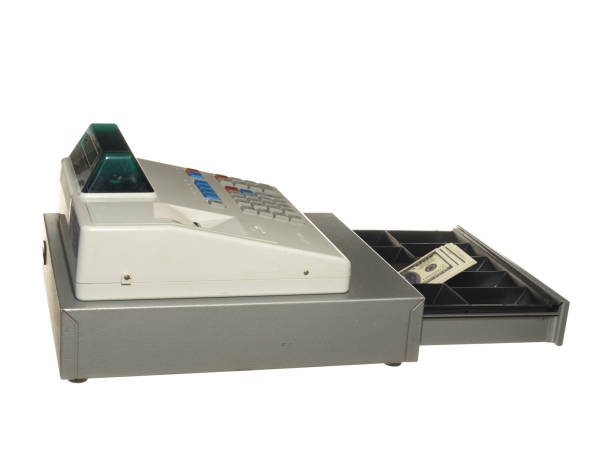 istock Cash register on a white background. Drawer is open. Inside a pack of dollars. 1182191578