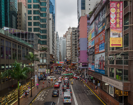 Hong Kong, Causeway Bay - November 8, 2014: Busy streets in Causeway Bay. The the area is a busy shopping district with luxury malls, department stores and boutiques