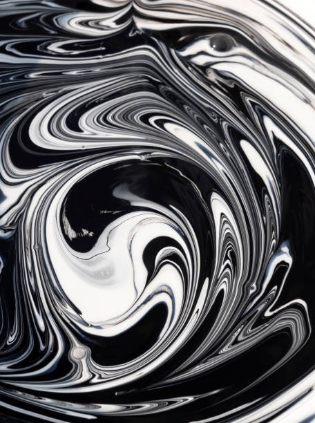 istock Streaks and patterns when mixing white paint with black pigment before staining 1182194643