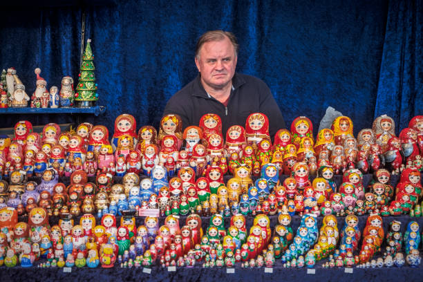 Berlin, Germany, September 21, 2019: Man selling russian dolls in the street at Berlin Alexanderplatz. Alexanderplatz was the center in the old East Berlin and are still a popular place for the berliners