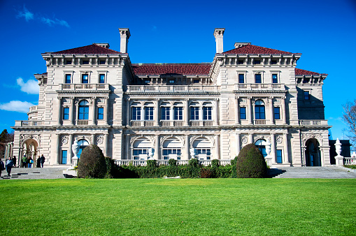 Newport, Rhode Island.  November 26, 2017. The historic exterior of the backside of the Breakers Mansion in late autumn in Newport Rhode Island on a sunny day.