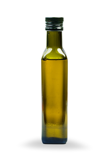 Glass bottle of olive oil isolated on a white background with clipping path. Template (mock up) for product design.