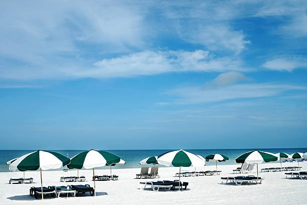 istock Beach lounge chairs and umbrellas 118220793