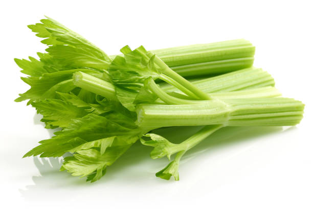 istock Fresh celery stalks and leaves isolated on white 1182208446