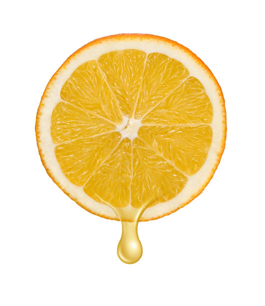 istock Juice dripping on cut half of orange 1182209626