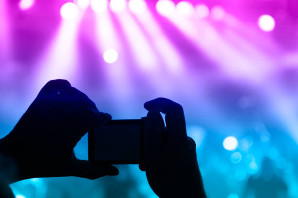 istock Filming concert on smart phone 1182209970