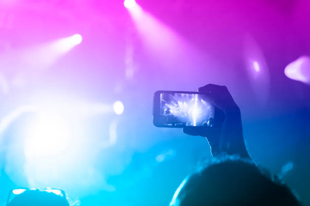 istock Filming concert on smart phone 1182209980