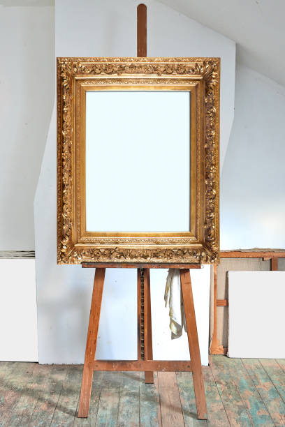 istock empty antique golden frame in an artist's studio 1182210153