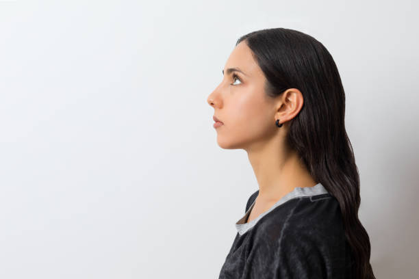 istock Young woman looking up 1182210884