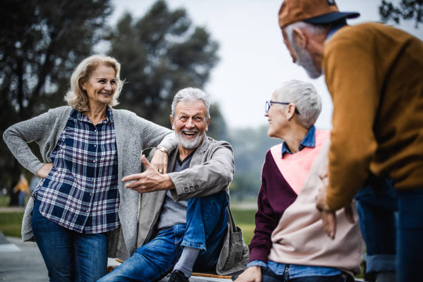 istock Happy senior couples talking while spending a day in the park. 1182211017