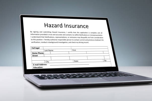 istock Laptop With Online Hazard Insurance Form 1182211269
