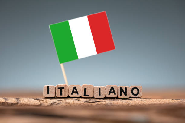 istock Italian Word Formed Using Wooden Block And Flag 1182211347