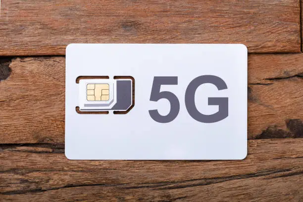 5G Mobile Phone Simcard On Wooden table