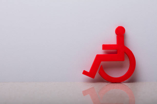 Close-up Of A Green Disabled Leaning On White Wall