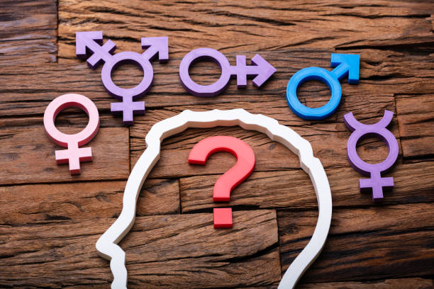 Undecided Gender Choice Concept Question Mark Inside Persons Head Outline And Multiple Gender Signs Around gender neutral photos stock pictures, royalty-free photos & images