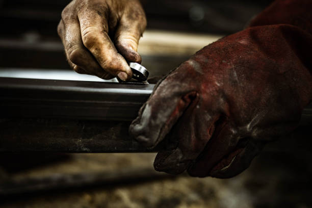 istock Close up of unrecognizable worker working with iron. 1182216199