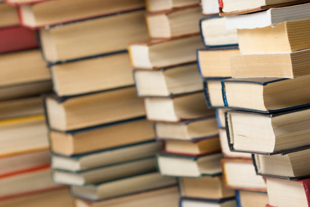 istock Stack of books background. many books piles. 1182216587