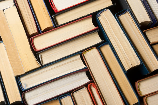 istock Stack of books background. many books piles. 1182216602