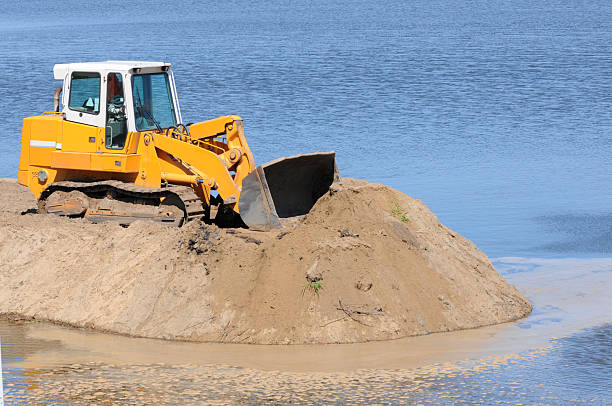 istock Grader on a Construction Site of river dam 118222369