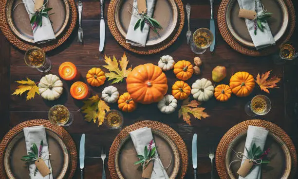 Photo of Thanksgiving celebration traditional dinner table setting