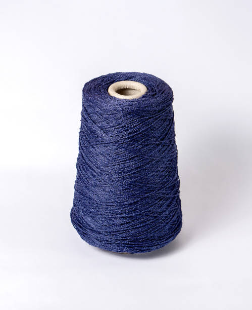 istock bobbin of yarn on a white background. Side view.Textile reel on isolated white background. 1182224688