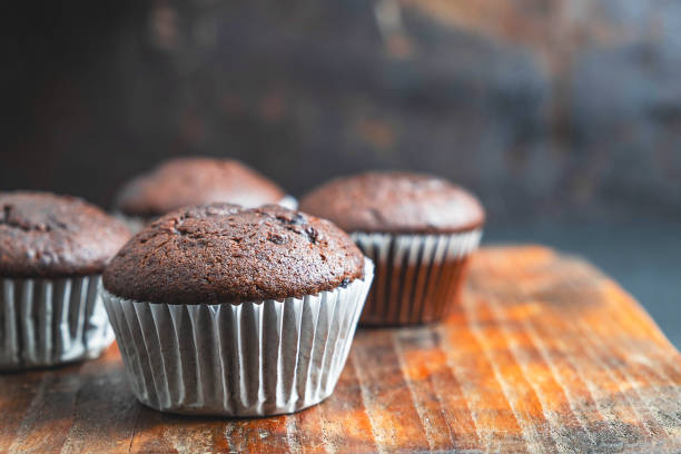 istock bakery chocolate cupcakes on wooden background 1182225041