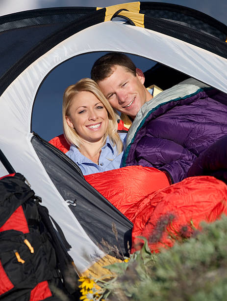 istock Happy Couple Sitting Inside Dome Tent 118222567