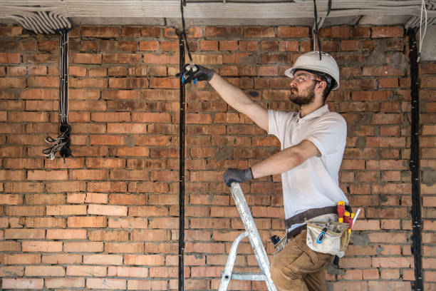 istock Electrician with tools, working on a construction site. Repair and handyman concept. 1182226261