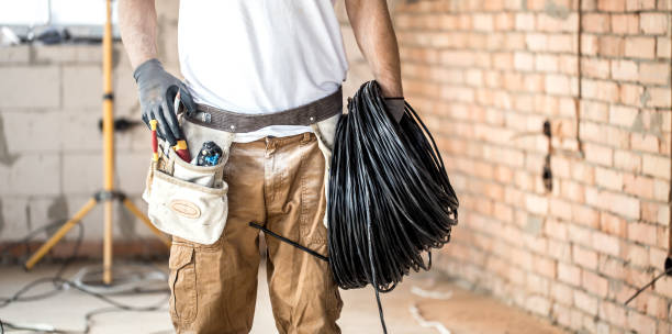 istock Electrician with tools, working on a construction site. Repair and handyman concept. 1182226317