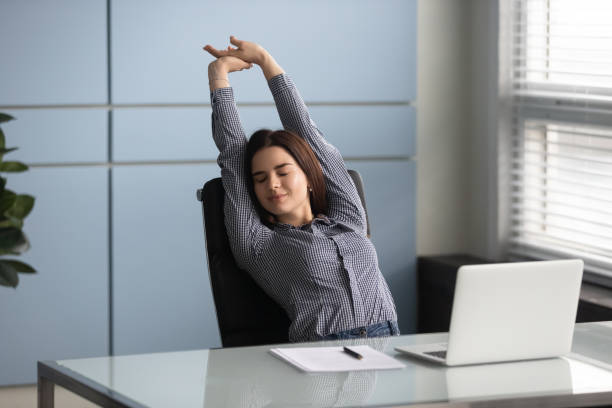 istock Satisfied with job done young female manager stretching back. 1182227874