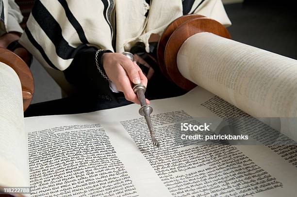Hand With A Silver Pointer Reading The Torah Stock Photo - Download Image Now - Jewish Prayer Shawl, Bar Mitzvah, Torah