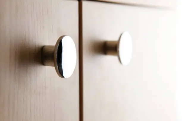 Close up of a cabinet door knob