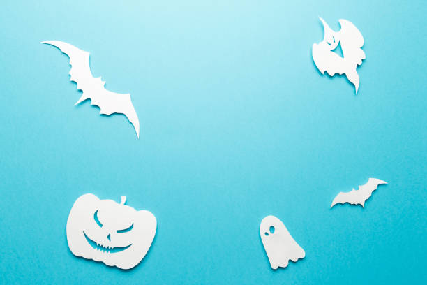 istock Halloween decorations. Halloween paper decorations on pastel blue background. Top view. Flat lay of accessory decoration Halloween festival. Copy space. Minimal creative concept. Pastel colors 1182233916