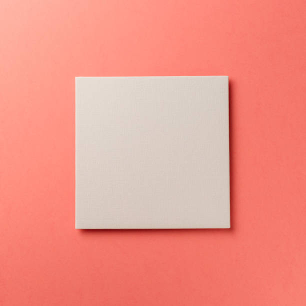 istock Creative layout made of paper blank on pastel on coral background. Top view. Flat lay. Copy space. Colorful background. Minimal creative concept. Living coral - trendy color of the year 2019 1182234077