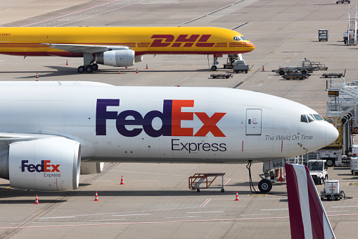 cologne, nrw/germany - 16 08 19: fedex and dhl  cargo airplanes at cologne bonn airport germany