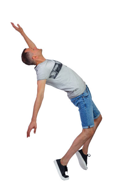 istock Side view of a man dancing in shorts. 1182239438