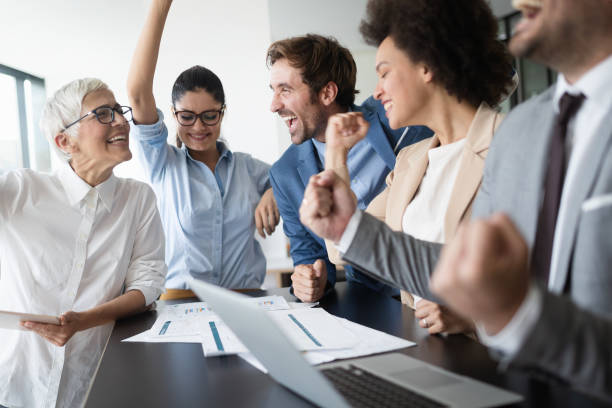 istock Group of successful business people at work in office 1182242660