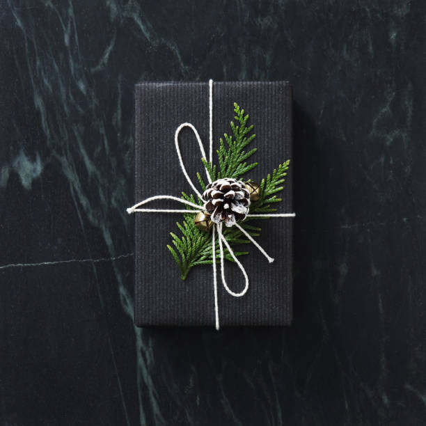 istock Christmas present wrapped in black paper 1182244888