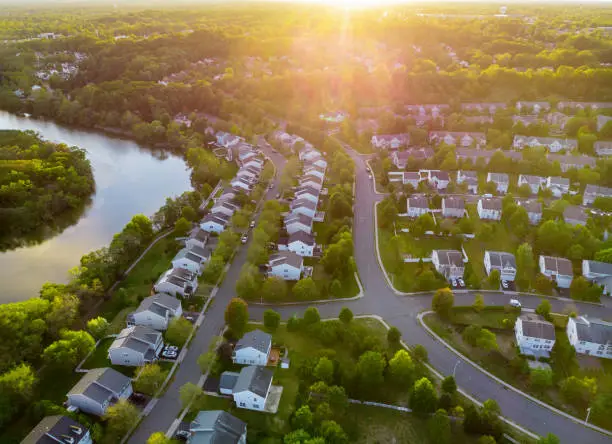 Photo of Aerial view of modern roofs of houses early sunrise