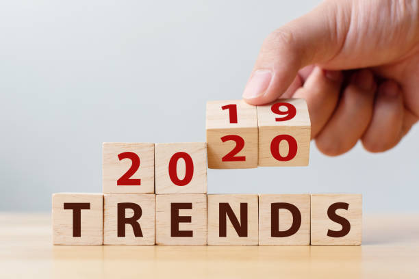 2020 trend concept. Hand flip wood cube change year 2019 to 2020 2020 trend concept. Hand flip wood cube change year 2019 to 2020 2019 stock pictures, royalty-free photos & images