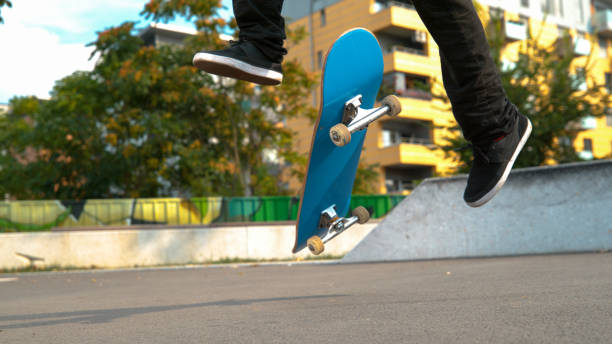 istock CLOSE UP: Unrecognizable man on skateboard does a cool flip trick at the park. 1182247314