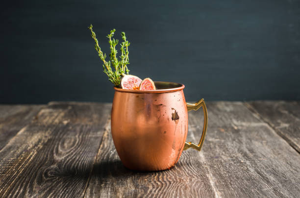 istock Moscow mule cocktail with figs and thyme on the rustic background 1182248057