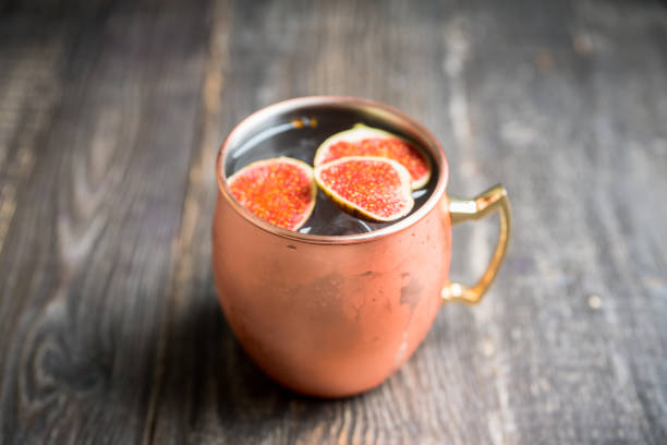 istock Moscow mule cocktail with figs and thyme on the rustic background 1182248059