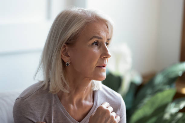 istock Close up image serious pensive sad aged female 1182248074