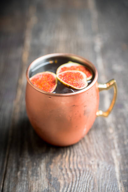istock Moscow mule cocktail with figs and thyme on the rustic background 1182248093