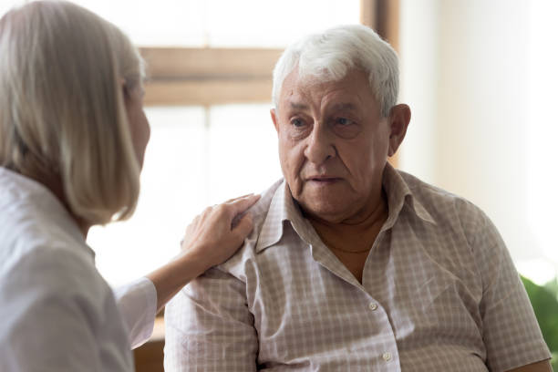istock 70s man patient and licensed practical nurse communicating indoors 1182248164