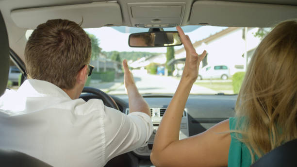 istock CLOSE UP: Young couple argues while driving through the sunny suburban area. 1182249390