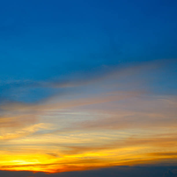 istock Cloudy sky and bright sunrise over the horizon. 1182251462